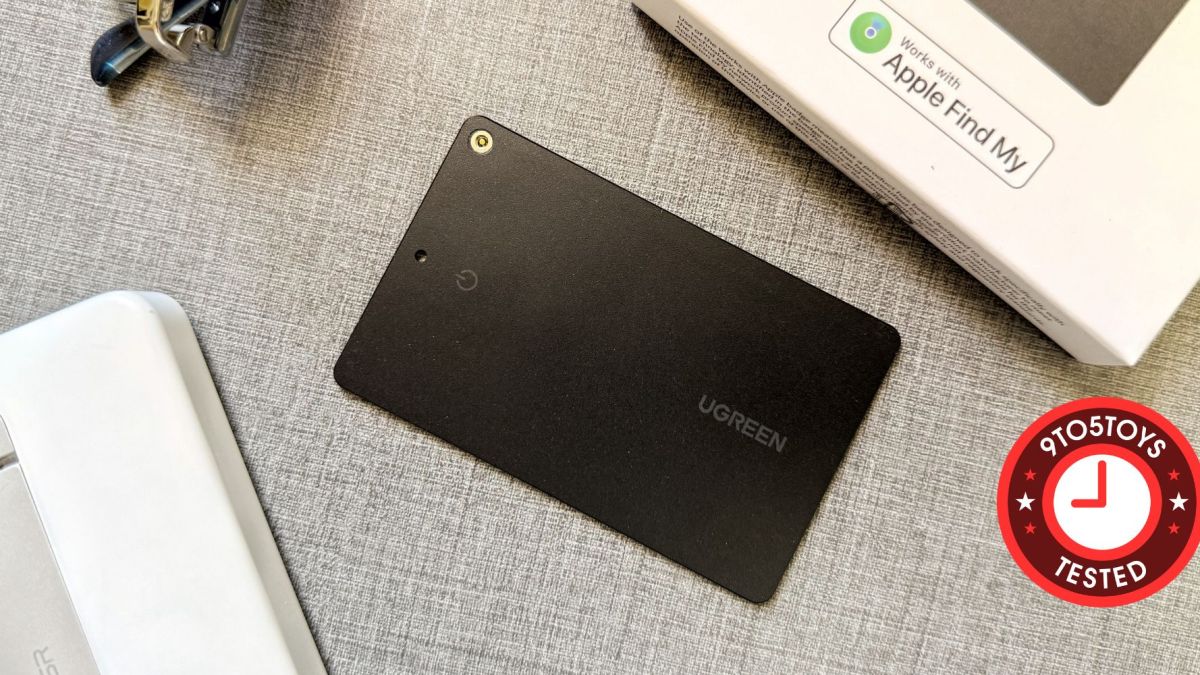 A rectangular black object on a grey surface